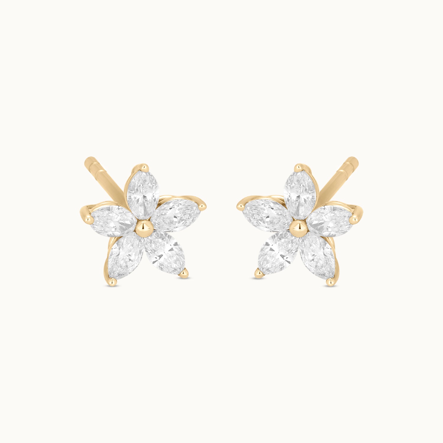 Pair of gold and diamond flower-shaped earrings