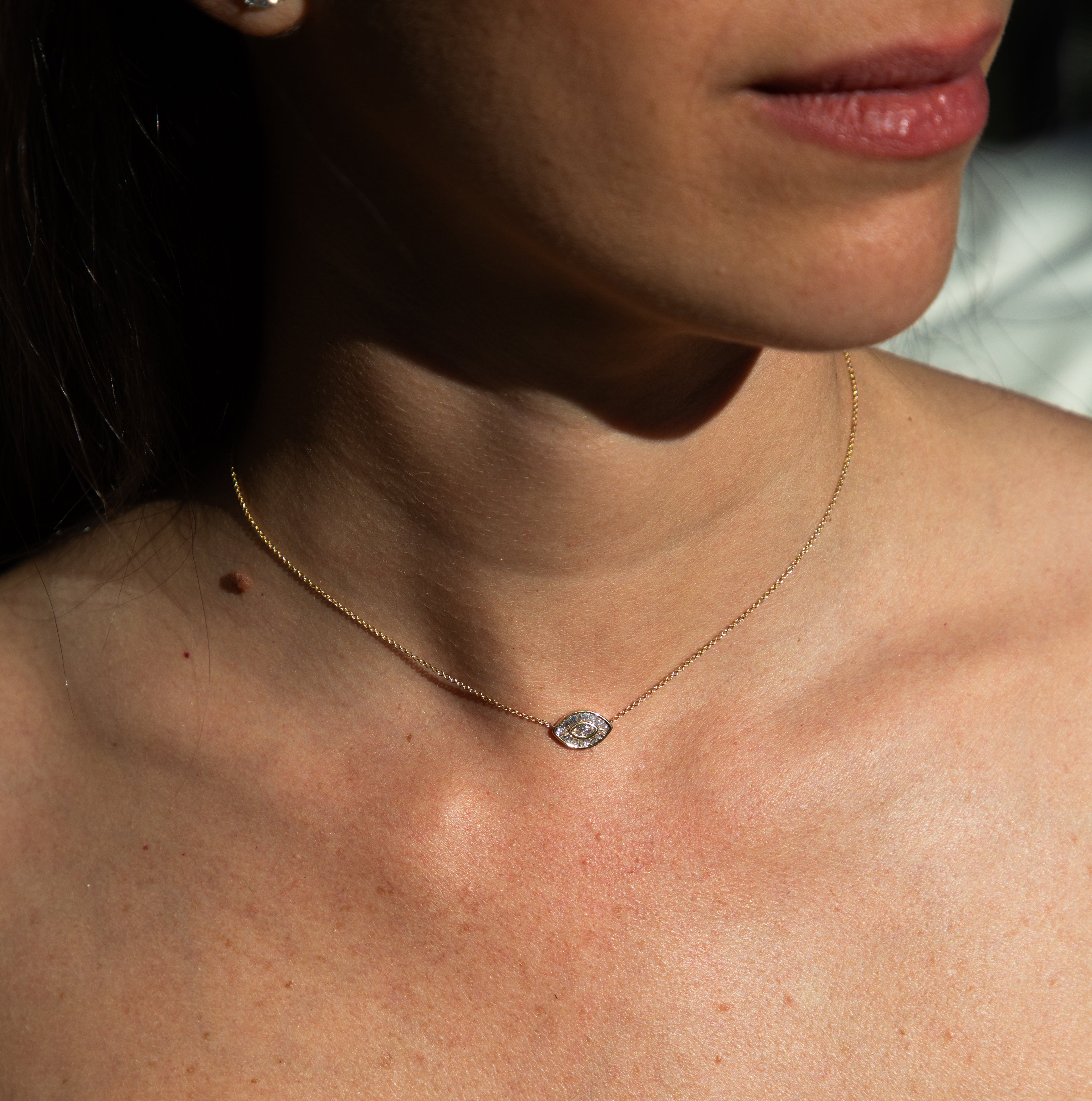 woman wearing gold necklace