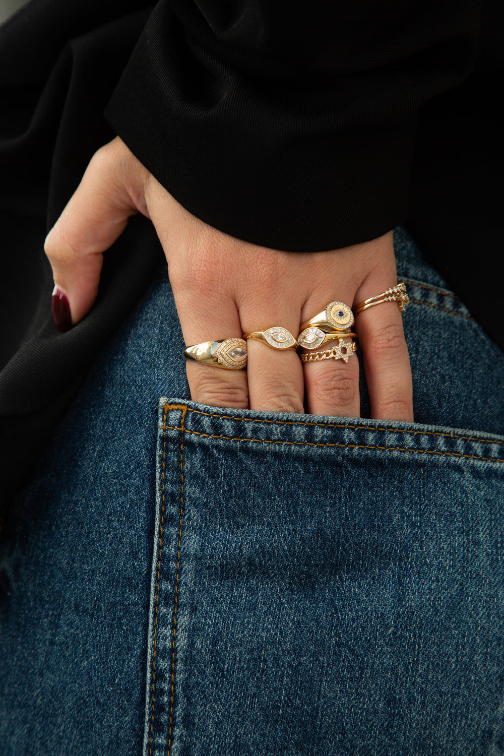 person wearing gold rings