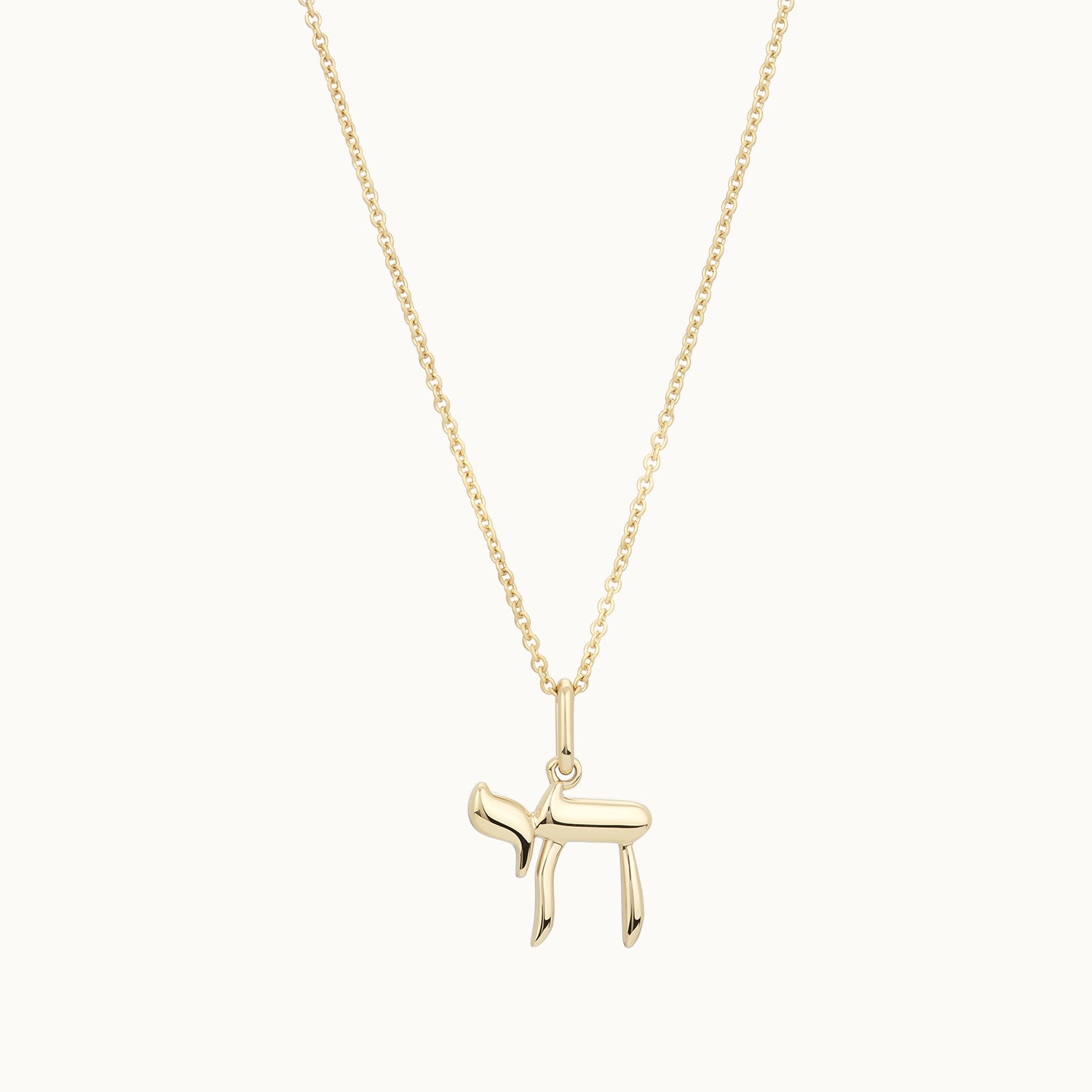 Gold necklace with a small pendant 
