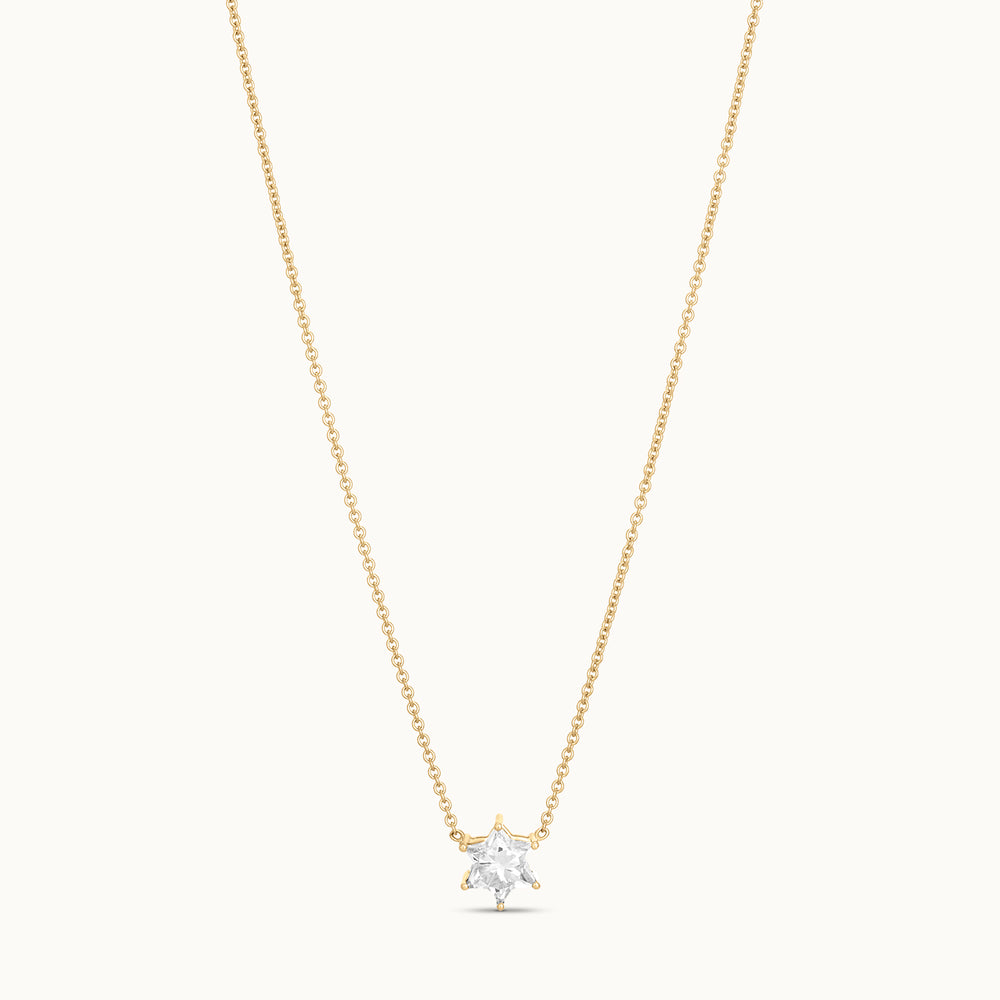 Gold necklace with a star-shaped diamond pendant