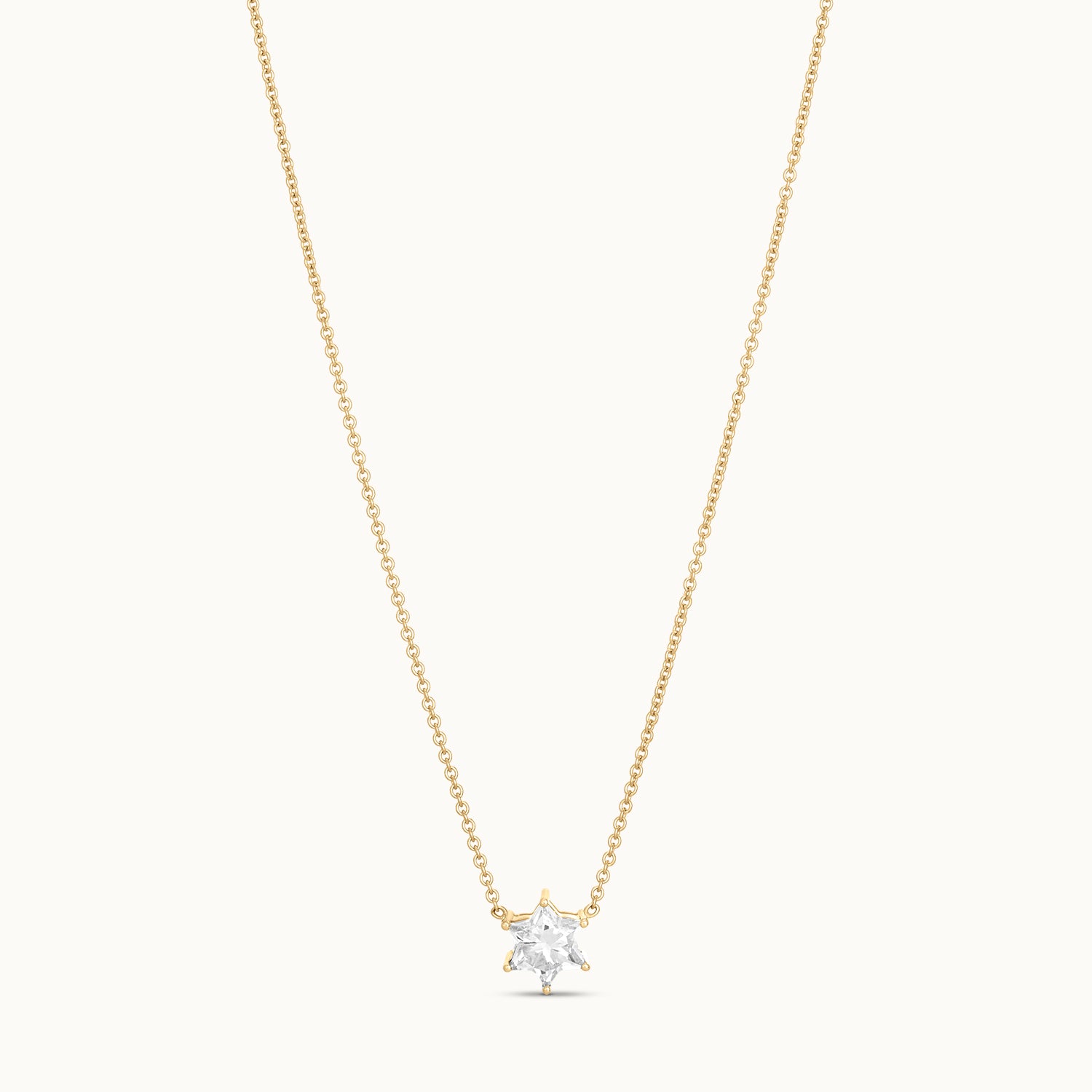 Gold necklace with a star-shaped diamond pendant