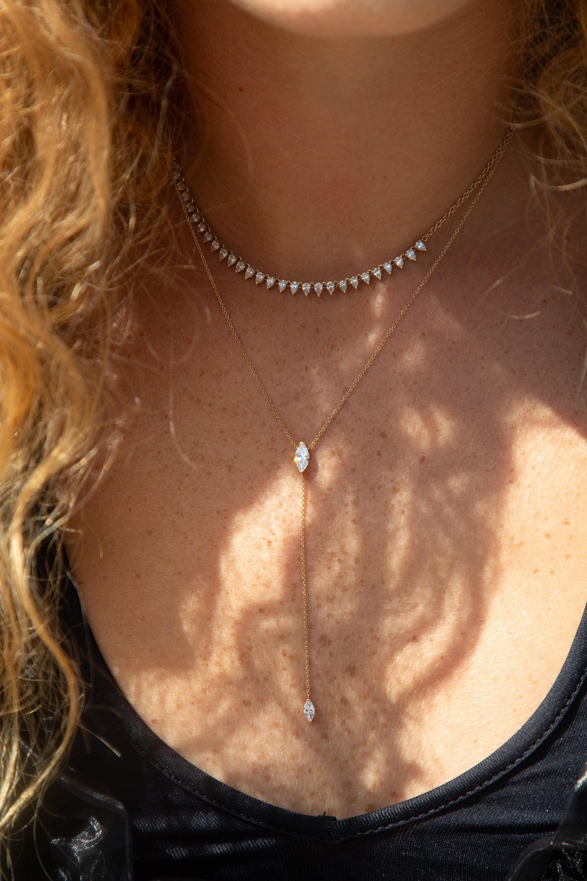Necklace with a pendant on a person's neck